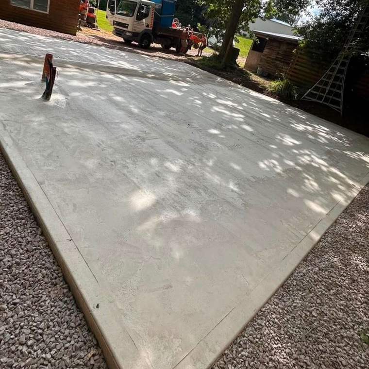 Freshly poured concrete slab foundation for a new build