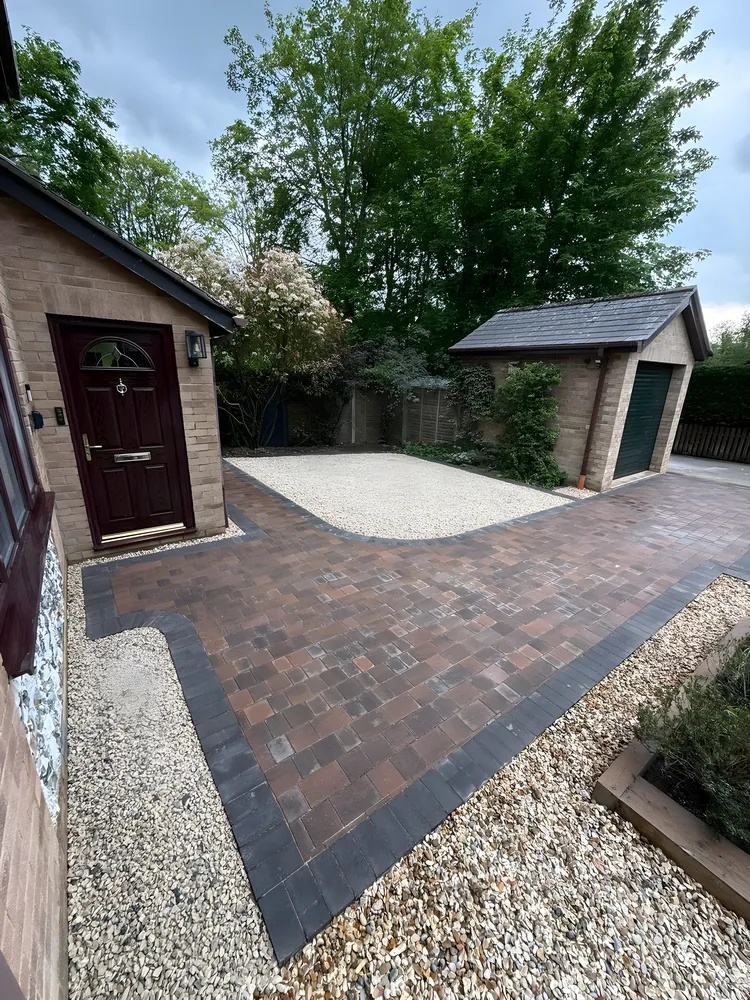 Brindle block paved driveway with a charcoal border and gravel edges
